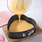 Heart-shaped nonstick cake mold with baked dessert